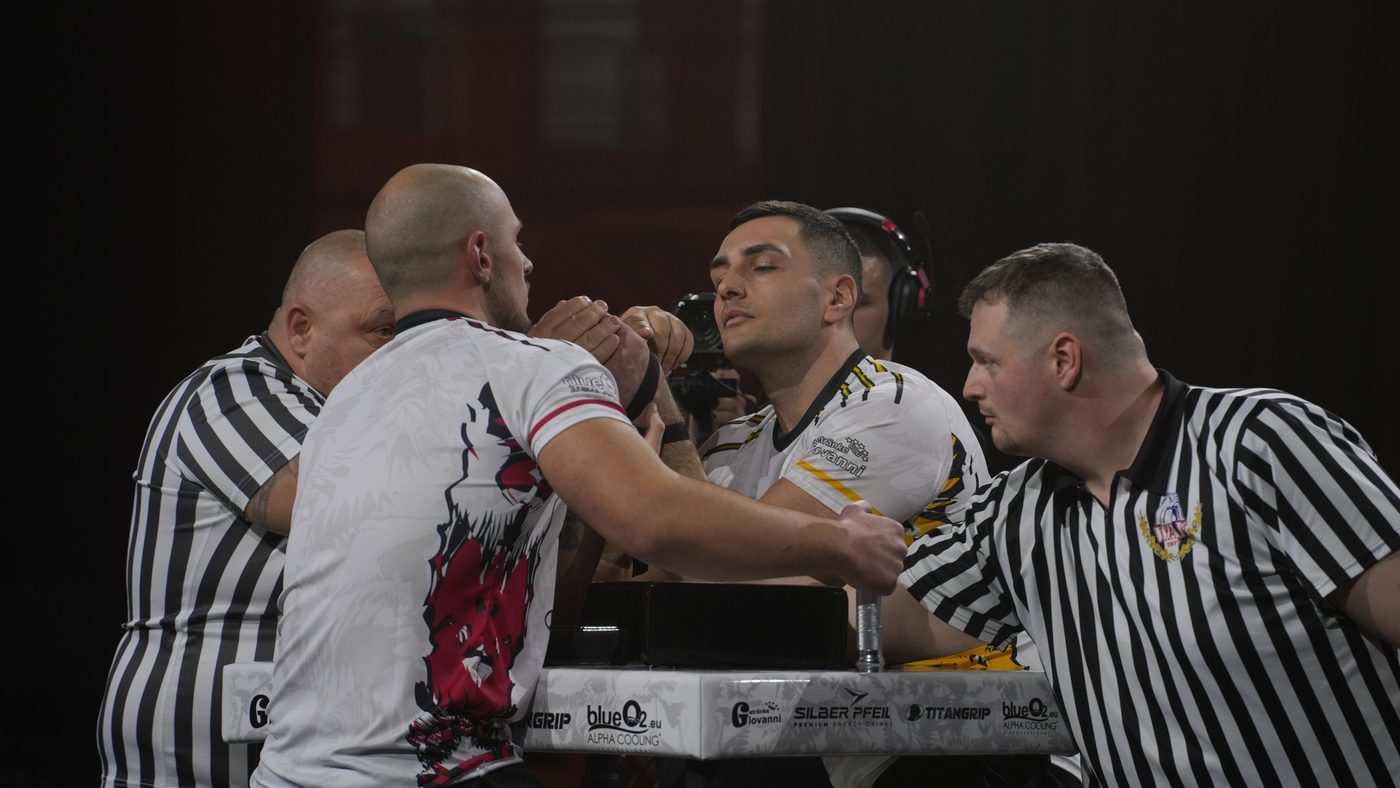 Qualifier match at the table with two referees